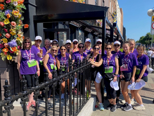 Ladies in running gear gathered on steps